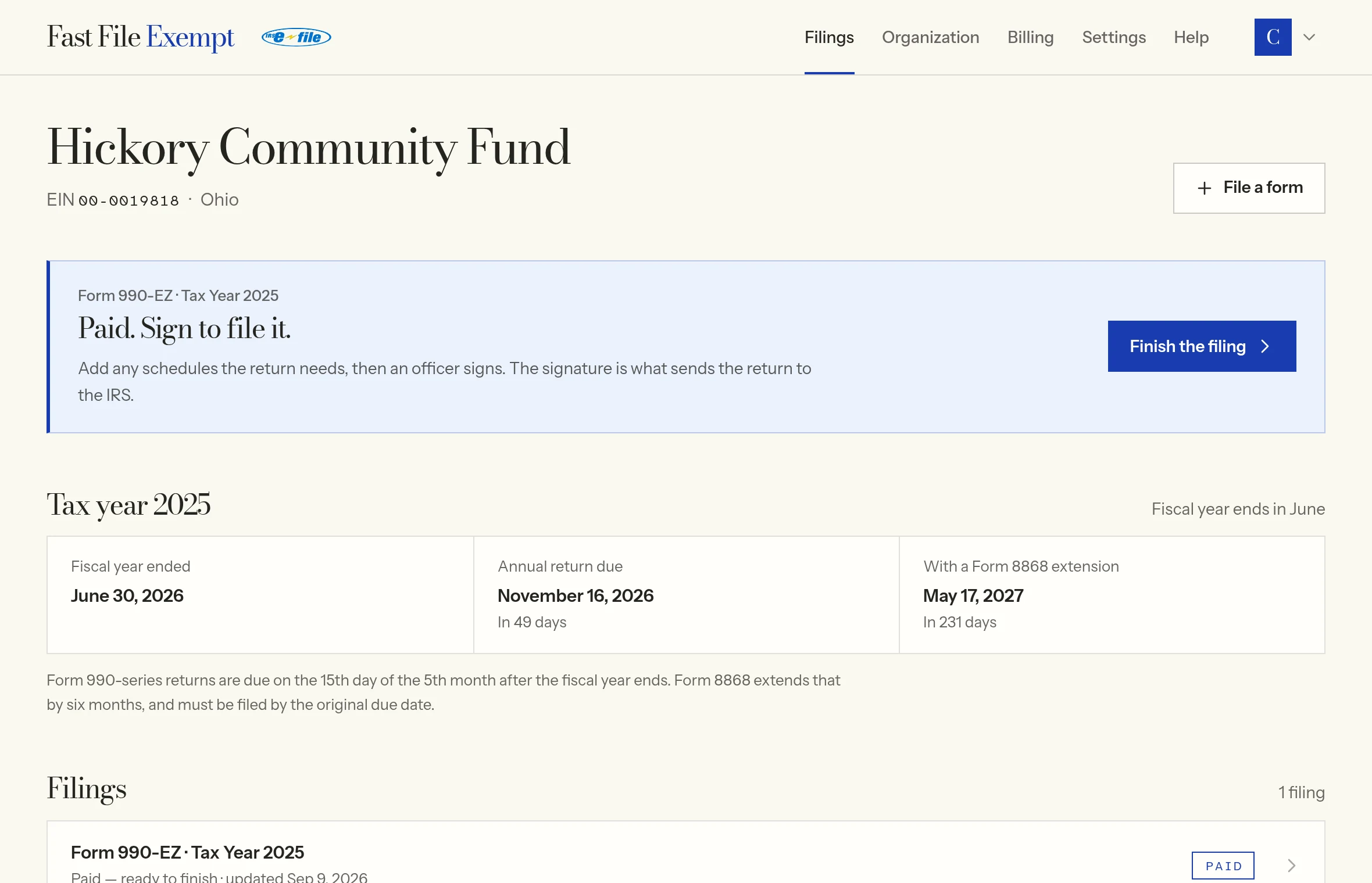 The filings page for a sample organization, showing a paid Form 990-EZ waiting for its schedules and an officer's signature, the tax year 2025 deadlines and the list of filings